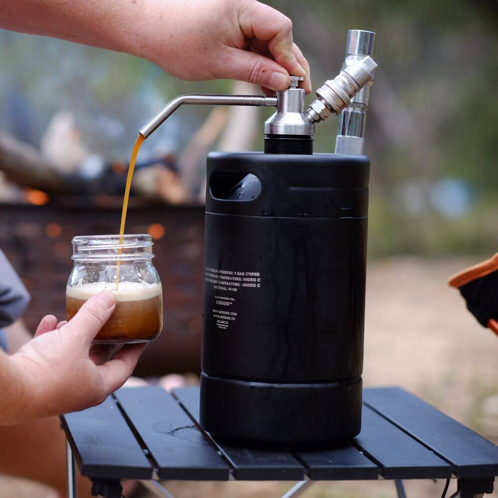 pouring nitro coffee from a mini keg